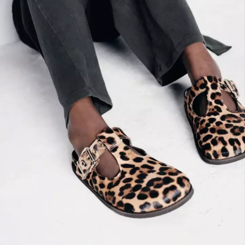 Lightly used animal print clogs